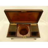 An early 19th century George III Tea Caddy in mahogany. The lid and corners decorated with figured