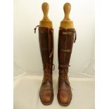 A pair of WWII officer boots with treen shoe horns
