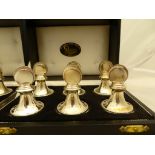 A Broadway and Co. Set of 12 sterling silver dinner place stands. Hallmarked 1991 and Boxed