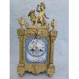 A C19th French mantle clock the hard paste porcelain hand painted panels depicting Neptune, Aurora