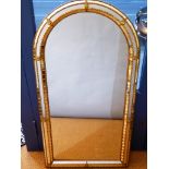 Mirror contemporary, with arch top and gilt metal frame decorated with faceted mirror sections. H