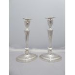 A pair of tall sterling silver candle sticks. Golldsmiths & Silversmiths Company. H28 W17cm. 1910-