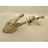 A pair of silver animals, alligator head and hippopotamus head toothpick holders