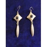 A pair of Mexican Alpaca silver coloured long earrings with onyx inset