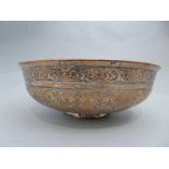 A Safavid C17th/C18th copper bowl with lead inlay the the repeating foliate incensed band to rim