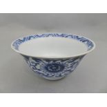 A Chinese Kanxi Blue and White bowl with central peony floral decoration to base, and allover flower