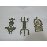 A set of three brass Islamic belt buckles from C12th and earlier