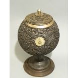 A C19th Indian carved coconut pot, finely carved, silver mounted with allover floral decoration,