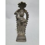 Three C18th/C19th Indian brass and copper castings, a Jane deity, a stoppered bottle and one other