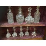 A collection of 9 decanters