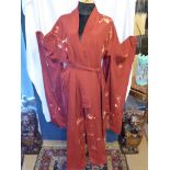 A Chinese silk robe with silk needle point flowers and butterflies