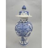 A Chinese Kanxi blue and white vase with allover scrolling ribbon and grapevine decoration, with lid