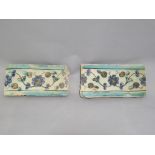 A pair of Turkish Iznik border tiles, white background with blue edging and floral repeating pattern