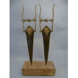 A pair of C19th Indian Katar push daggers, mounted on a block mount the triangular steel blades