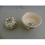 Two early Qing dynasty Chinese pots with lids, with provincial floral and scrolling detailing, and a