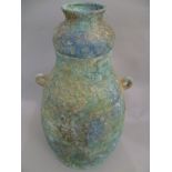 A Chinese archaic bronze (possibly Ming Dynasty) vessel with shaped lid, above twin ringed