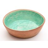 A Fremington pottery baking dish: of oval form,