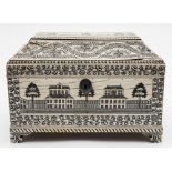 An Anglo-Indian stained ivory tea caddy: decorated on each side with colonial buildings in