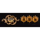 A citrine mounted three stone bar brooch: with hexagonal citrines within a beadwork setting and an