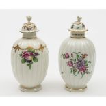 Two Worcester tea canisters and covers: each of reeded ovoid form with flower finials,