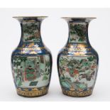 A pair of Chinese famille verte vases: each of baluster form with waisted neck,