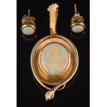 An oval opal, single stone pendant: the opal approximately 17mm long x 14mm wide,