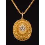 A Victorian gold and diamond set oval,