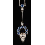 A sapphire and diamond lavalier: with circular openwork cluster of round sapphires and single-cut