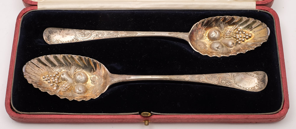 Two George III silver Hanovarian pattern and later decorated berry spoons,