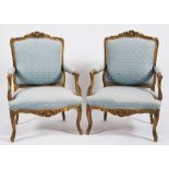 A pair of 19th Century French carved giltwood fauteuils in the Louis XIV taste:,