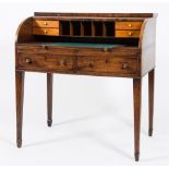 A George III mahogany cylinder tambour fronted writing desk:,