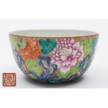 A Chinese porcelain bowl: decorated in the famille rose palette, the exterior with chrysanthemum,