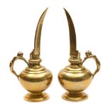 A pair of brass rosewater ewers: of cylindrical form with slender curved V-shaped spouts,