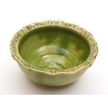 An Edward Sadler (Fremington) pottery bowl: of circular form with everted wavy rim incised on a