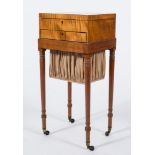 An early 19th Century satinwood and inlaid work table in the Sheraton taste:,