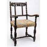A 17th century carved walnut elbow chair used by HRH Princess of Wales at the 1909 Huccaby Races,