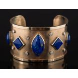 A diamond and lapis lazuli mounted cuff bangle: the wide band inset with round,