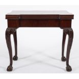 A 19th Century carved mahogany triple top games and tea table in the George II taste:,