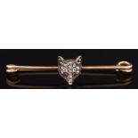 A late 19th century gold, silver and rose diamond mounted fox mask bar brooch:.