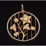 A seed pearl mounted circular pendant: of floral design on fine curb-link chain, 4.