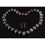 A banded agate graduated bead single string necklace: the beads graduated from 10.5mm to 15.