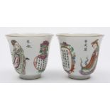 A pair of Chinese porcelain wine cups: of mildly flaring form,