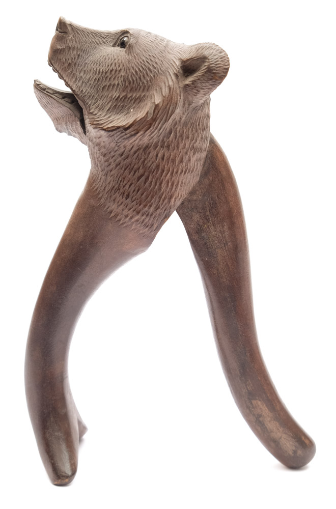 A Black Forest carved hardwood nutcracker: in the form of a bear's head, with inset glass eyes, - Image 2 of 2