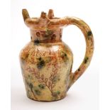 A Donyatt pottery puzzle jug: of shouldered form with raised pierced neck,