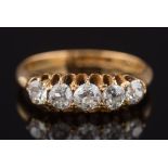 An 18ct gold and diamond five stone ring: with graduated,