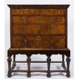 An early 18th Century walnut veneered chest on a later stand:,