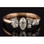 An 18ct gold and diamond six stone ring: with marquise-cut and cushion-shaped diamonds estimated to