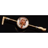 A reverse painted crystal intaglio, gold backed fox mask mounted 'crop' bar brooch:,