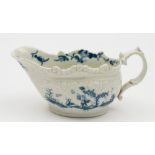 A small Worcester blue and white sauceboat: of squat form with double scroll handle,