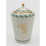 A Worcester tea canister and cover: of reeded tapering cylindrical form with pointed finial,